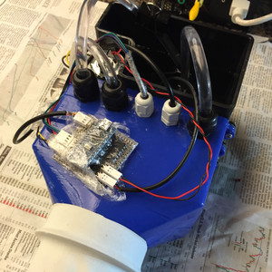 Assembled project. The user places their hand into the glove at the front of the device and grips the cold pipe inside, while the air is sucked out of the vacuum chamber.