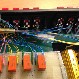 The relay inputs and outputs are soldered onto the original speaker wire jacks.